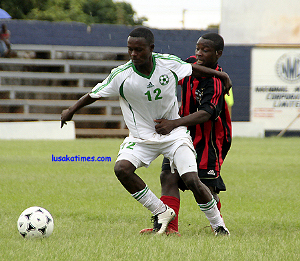 buffaloesvszanaco2 Green Buffaloes' Sebastian Mwansa shrugs off ZANACO's Michael Bwalya during the KCM-FAZ mid-week match played at Woodlands stadium in Lusaka.