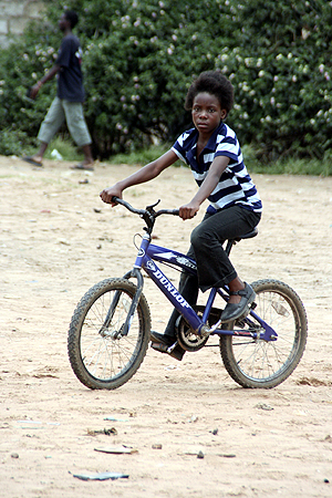 girldpeddling AN un identified girl peddling her bicycle