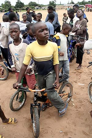 kids Children waiting for their turn to take to the tracks for a cycling race