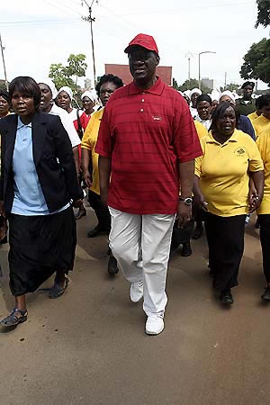 ronnie INFORMATION and Broadcasting minister Ronnie Shikapwasha walking with christina women during the commemoration of the world day of prayer along Nurma road