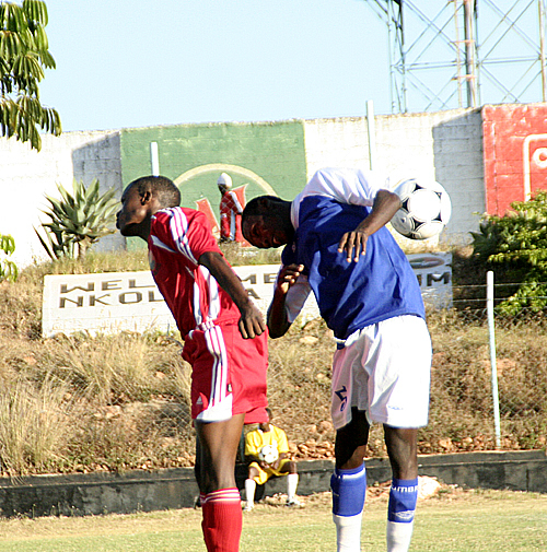 redarrows1 Kabwe Warrior's Metusela Chipupu (r) and Young Arrows' Katuka Shaft fail to headbutt the ball during the KCM-FAZ week seven match played at Lusaka's Nkoloma Stadium in Lusaka. Arrows won 2-1