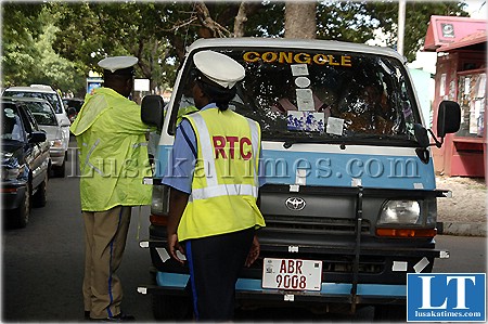 http://www.lusakatimes.com/wp-content/uploads/2009/11/Give-us-a-bribe...Traffic-police-officers-confront-a-public-service-bus-driver-at-Longacres-in-Lusaka.jpg
