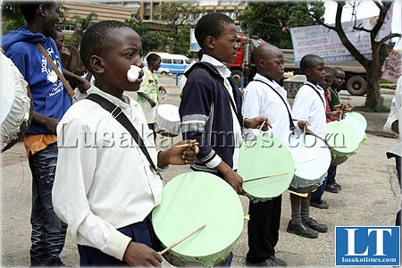 Youthful members of Ushers Band and majorettes playing home made