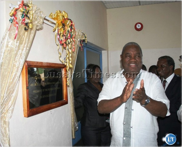 President Rupiah Banda applauds after unveiling the placard during the commissioning of the first phase of the construction of infrastructure at Chipata Trades Training Institute in Chipata recently.