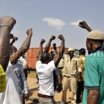 File:PF cadres wielding their party symbol outside the Lusaka magistrate court