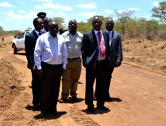 President Michael Sata talks to Zulu Burrow Consultant Engineer Levy Zulu, when the President inspected the Chiawa-Chirundu road construction