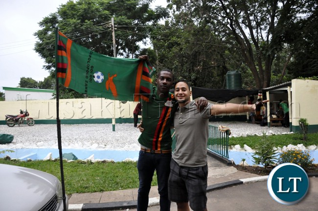 A couple of soccer fans captured in a high mood before the Zambia Bukina Faso match in Lusaka
