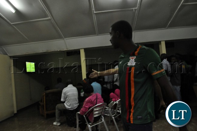 A soccer fan reacts after Zambia missed scoring opportunities during the match against Bukina Faso.