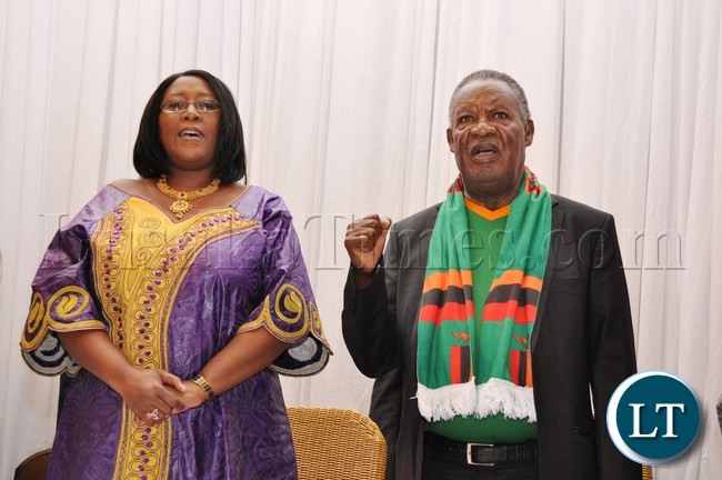 First Lady Dr Christine Kaseba and President Michael Sata singing the national Anthem at Protea Hotel Nelspruit in South Africa where President Sata addressed the National Team players