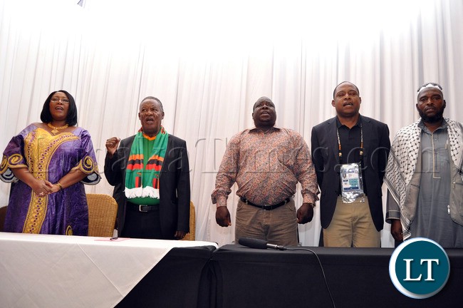 First Lady Dr Christine Kaseba, President Michael Sata, Sports minister Chishimba Kambwili, FAZ President Kalusha Bwalya and South African premier singing the National Anthem at Protea Hotel Nelspruit in South Africa where President Sata addressed the National Team