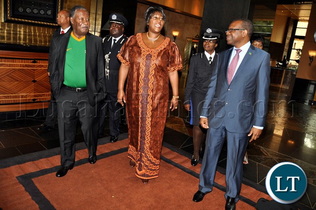 President Sata with First Lady Dr Christine Kaseba and Zambia's High Commissioner to South Africa Muyeba Chikonde leaves Hyatt Hotel in South Africa for the official opening of AFCON in SOuth Africa