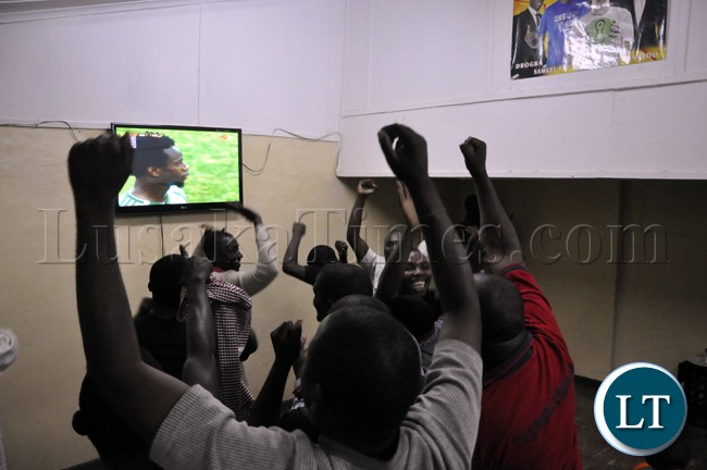 Soccer fans cheering the Chipolopolo team during the match against Bukina Faso which saw Zambia exit the AFCON 2013 event
