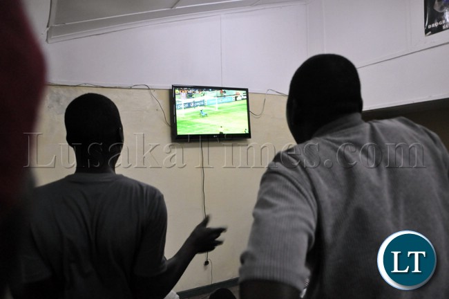 Soccer fans following the Zambia versus Bukina Faso match during the live broadcast in Lusaka