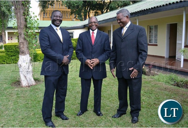 Zambia Railways Board of Directors Chairperson Mark Chona (centre) shares a light moment with Deputy Board of Directors Chairperson Professor Oliva Saasa (left) and Zambia Railways Managing Director Professor Clive Chirwa