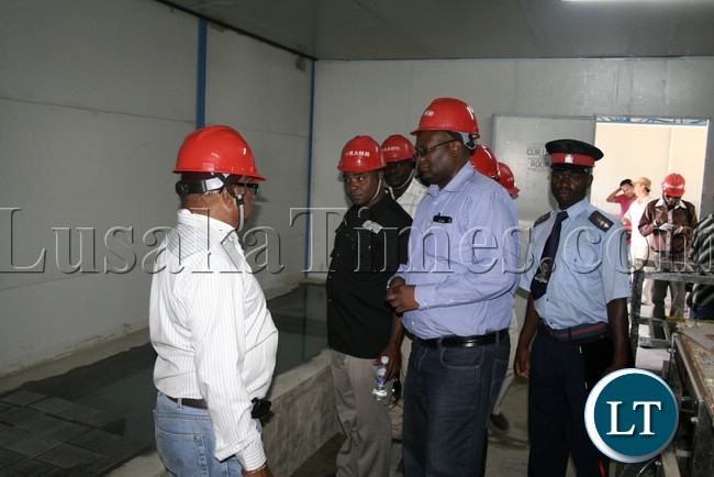 (Mongu-Kalabo Road) Western Province Permanent Secretary Emmanuel Mwamba and entourage visit the test lab during the tour of the AVIC bridge department at their comp site of Mongu–Kalabo Road