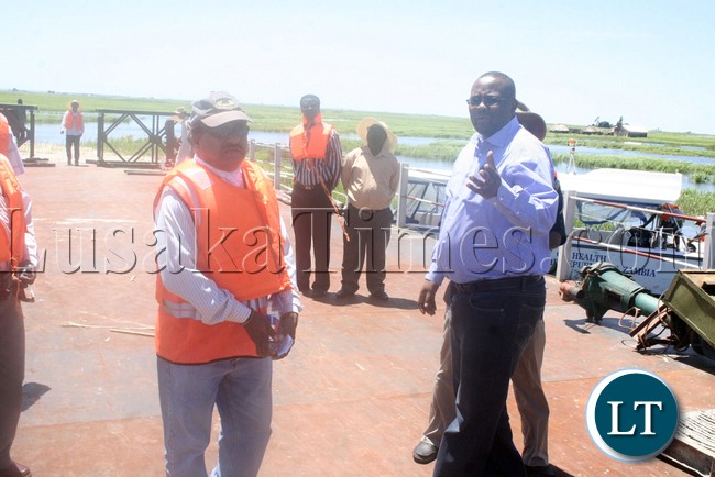 (Mongu-Kalabo Road) Western Province Permanent Secretary Emmanuel Mwamba speaking to Rankin Resident Engineer Ramesh Suryawanshi during the visits of the temporal bridge at the Zambezi River along Mongu –Kalabo Road