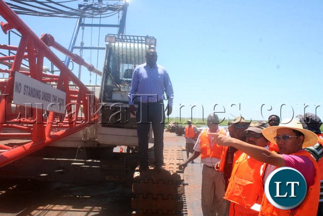 (Mongu-Kalabo Road) Western Province Permanent Secretary Emmanuel Mwamba inspecting temporal bridge at the Zambezi River along Mongu yesterday –Kalabo Road