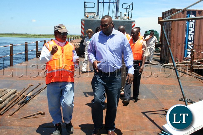 (Mongu-Kalabo Road) Rankin Resident Engineer Ramesh Suryawanshi and Western Province Permanent Secretary Emmanuel Mwamba inspecting temporal bridge at the Zambezi River along Mongu –Kalabo Road
