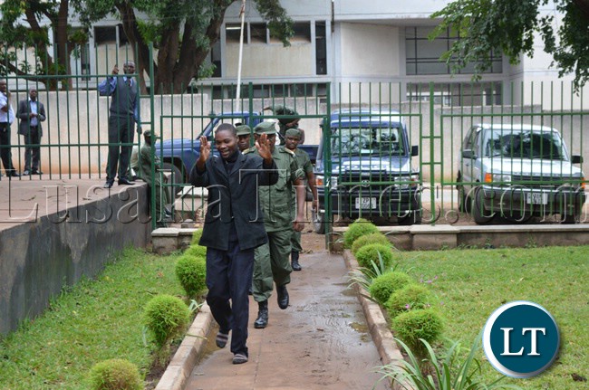 Late Harrison Chanda’s murder suspect Henry Lungu (in front) arrives inside the court premises to appear in Livingstone Magistrate Court