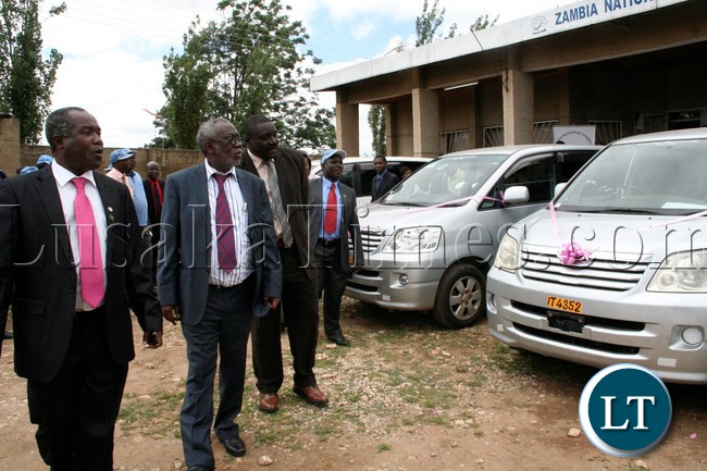 Labour Minister Fackson Shamenda flanked by ZNUT President Henery Kapenda (l) and ZNUT General Secretary Newman Bubala (r) checks the vehicles on the occasion of the handover of vehicles to Provinces and Women's Committee by ZNUT at ZNUT Offices in Lusaka,