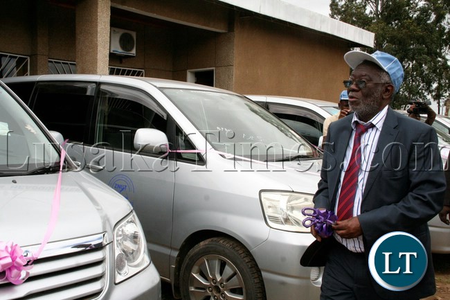 Labour Minister Fackson Shamenda flanked by ZNUT President Henery Kapenda (l) and ZNUT General Secretary Newman Bubala (r) checks the vehicles on the occasion of the handover of vehicles to Provinces and Women's Committee by ZNUT at ZNUT Offices in Lusaka,