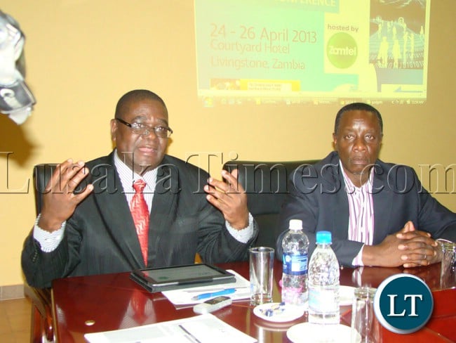 SOUTHERN Africa Telecommunication Association (SATA) Executive Secretary Jacob Munondawafa speaks during the press briefing at Courtyard Hotel while Chief Executive Dr. Mupanga Mwanakatwe listens in Livingstone