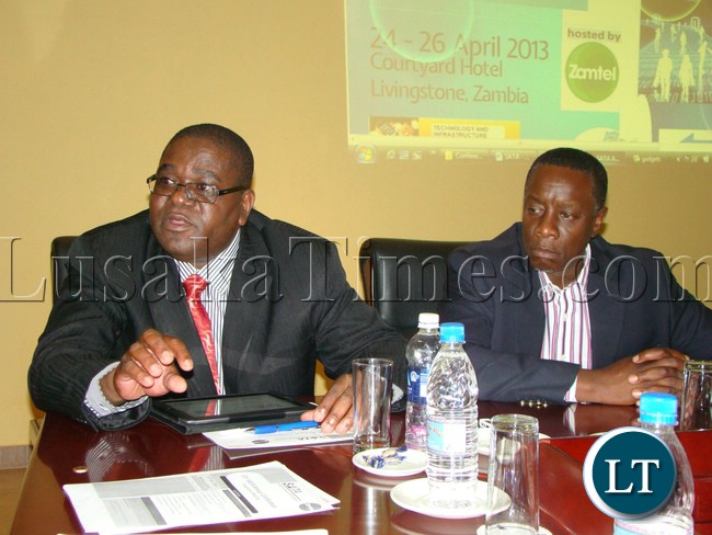 SOUTHERN Africa Telecommunication Association (SATA) Executive Secretary Jacob Munondawafa speaks during the press briefing at Courtyard Hotel while Chief Executive Dr. Mupanga Mwanakatwe listens in Livingstone