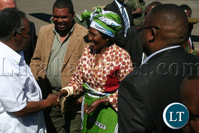 Minister of Gender and child Development Inonge Wina welcomes President Michael Sata shortly after the President arrives at Mongu airport ahead of by-elections for Lukulu west