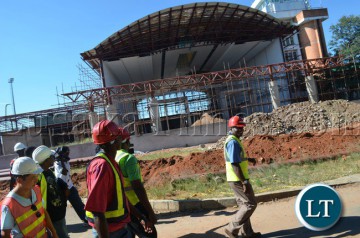 National Airport Corporation Limited (NACL) managing director Robinson Misitala (right) lead members of the local and national organising committee for the UNWTO during the tour of the new terminal building under construction at Harry Mwaanga Nkumbula International Airport in Livingstone