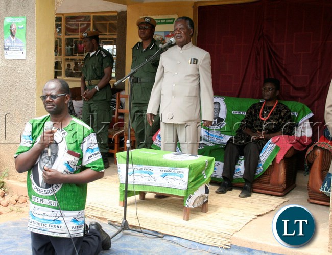 President Sata at the rally at Ngambwe Primary School asks the PF Candidate for Kapiri Eddie Musonda to kneel before the people of Ngambwe during his campaign tour for the Kapiri by-elections in Kapiri, April 13, 2013.