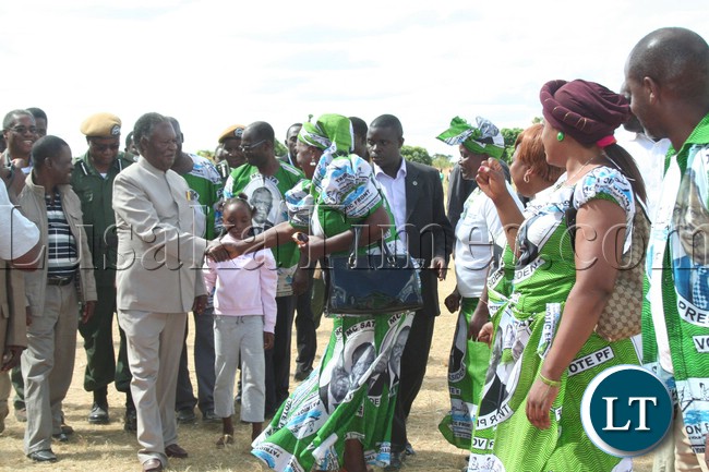 President Michael Sata greeting the patriotic front members upon arrival at meembe basic school grounds ,where he held a rally in support of the kapiri mposhi bye election (PF) candidate Eddie Musonda