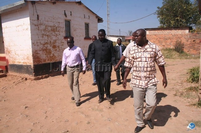 KIPUSHI border Immigration department officer-in-charge Brighton Songiso (right) leads Home Affairs deputy minister Nickson Chilangwa (left) and regional Immigration officer Mufalili Nasilele (middle) during the conducted tour of Immigration houses at Kipushi border post, about 136 km east of Solwezi district in Solwezi east constituency