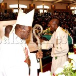 Archdiocese of Lusaka Archbishop George Mpundu leaves after the funeral Service of late Benjamin Mwila at the Cathedral of the Child Jesus in Lusaka on August 22,2013 -Picture by THOMAS NSAMA