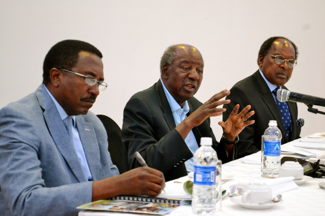 Finance Minister Alexander Chikwnda is flanked by Secretary to the Treasury Fredson Yamba (left) and Bank of Zambia Governor Michael Gondwe (right) at a media breakfast at Taj-Pamodzi hotel in Lusaka