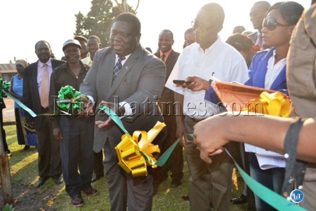TRANSPORT, Works, Supply and Communication Minister Yamfwa Mukanga cuts a ribbon as he hands over medical equipment to Kamuchanga Hospital donated by Mopani Copper Mines.