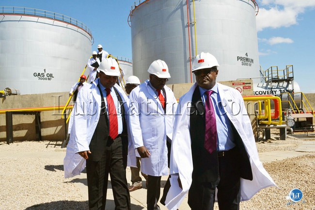 Mines, Energy and Water Development Minister Christopher Yaluma (right) and his Deputy George Zulu (centre) inspect the Lusaka fuel storage depot with Lusaka Province Minister Obvious Mwaliteta before commissioning of the plant