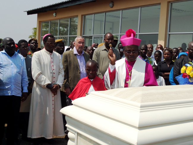 Chipata Diocese Catholic Bishop George Lungu,Vice President Dr Guy Scott and Eastern Province Minister Malozo Sichone witnessing the blessings of the casket of Cardinal Medardo Mazombwe by Auxilliary Bishop Benjamin Phiri at Chipata Airport in Chipata