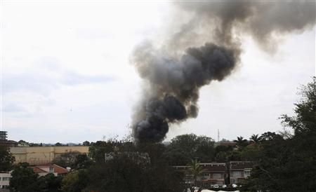 Smoke rises over Westgate Shopping Centre after an explosion in Nairobi, September 23, 2013. REUTERS/Goran Tomasevic