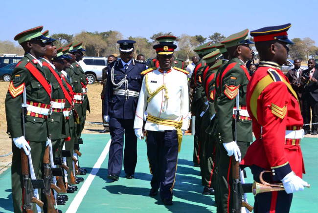 President Michael Sata inspects a guard of honour mounted by the Officer Cadets before being commissioned at Kohima barrack in Kabwe