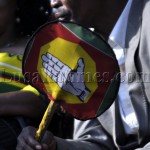 A man raises a placard wth the UPND party symbol