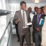 President Michael Sata listens to Mr Abraham Mwanamwenge the World
Health Organisation logistics Advisor after officialy commissioning
the provincial vaccine store in Mansa