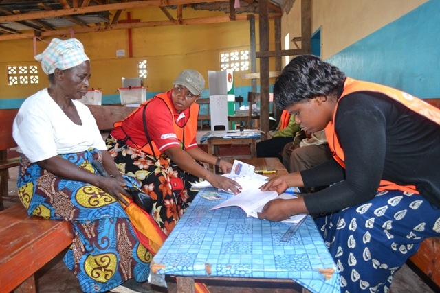 ELECTORAL Commission of Zambia (ECZ) official Mukiti Lukonga (standing) checking voting proceedings at St Clement’s Polling station during the Mansa Central by-election