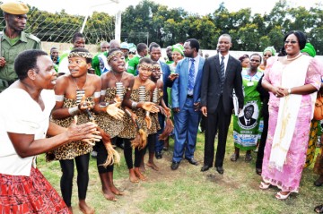 First Lady Dr Christine Kaseba being entertained by Mukanzuko dance troupe from Chisekese on arrival at Nakambala grounds for the International Women's Day in Mazambuka on May 8,2014 -Picture by THOMAS NSAMA