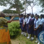 Deputy Minister in the Ministry of Chiefs and Traditional Affairs Susan Kawandami talks to pupils in Ndola