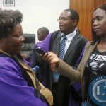 LUANSHYA Deputy Mayor elect Elizabeth Mulenga being interview by a journalist shortly after being elected in the Council Chamber at the Civic Centre yesterday as mayor elect Gordon Siwale looks on