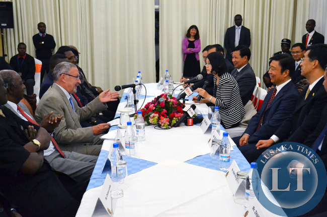 Vice President Guy Scott talks to Chinese Vice President Li Yuanchao during a meeting at Government House in Lusaka