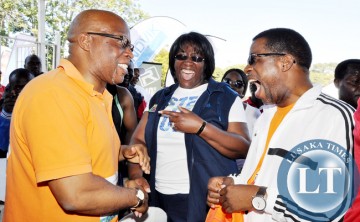 First Lady Dr Christine Kaseba share a light moment with MMD president Dr Nevers Mumba and ZAAA president Elias Mpondela (r) during the Inter Company relay. Dr Christine Kaseba yesterday took part in a 5 kilometre walk in Lusaka on June 14 -Picture by THOMAS NSAMA