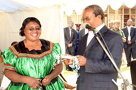 kasama Auditor General Anna Chifungula receives keys from ministry of finance permanent secretary Wamundila Mbikusita-Lewanika for the auditor's office in Kasama during the official opening
