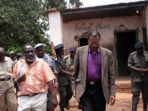 mpombo11 DEFENCE minister George Mpombo (with bottle) with north western province permanent secretary Jeston Mulnado when he inspect infrastructure at Kipushi border in Solwezi
