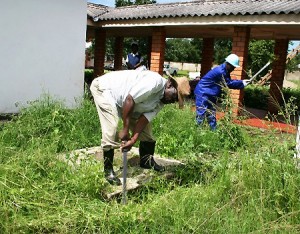 jazzman LUAPULA province permanent secretary Jazzman Chikwakwa slashing grass at Twikatane Foundation Centre during a preventive maintenance programme in Mansa